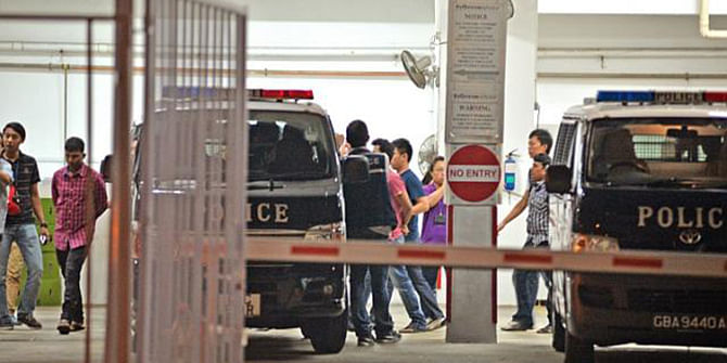 Police arrest 35 foreign workers involved in a fight at Homestay Residences at Kaki Bukit Avenue 3 on March 25. Eight Bangladeshi workers have been cleared of the dormitory riot - which is thought to have erupted over the result of a cricket match. This photo is taken from The Straits Times.