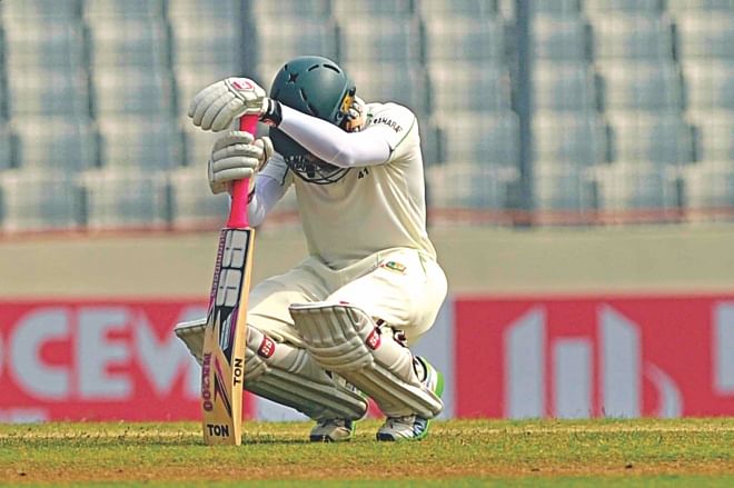 Bangladesh captain Mushfiqur Rahim puts his head down in dismay, at Mirpur, after the hosts lost the crucial wicket of Mominul Haque in the post-lunch session yesterday. The Tigers were bundled out for 250 on the fourth day of the first Test and went down to Sri Lanka by an innings and 248 runs -- their fourth worst innings defeat. The match saw the Tigers leak 730 runs in one innings. It was a flow-stopper for the Tigers', who had otherwise had a good run in the last two years. Photo: Star