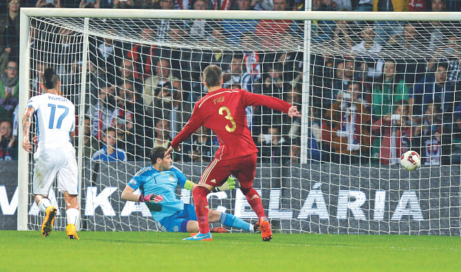 Spain goalkeeper Iker Casillas (C) misses the ball to concede the opening goal during their Euro 2016 qualifier against Slovakia in Zilina on Thursday. Photo: AFP