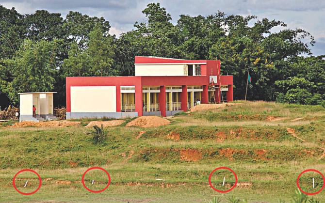 A school built inside the EPZ puts temporary pillars to show that it is outside the EPZ. Photo: Star