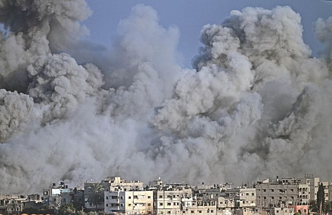 Humanitarian  Crisis  In  Gaza: Smoke and debris fill the air during an Israeli strike on Gaza City early yesterday. Photo: AFP