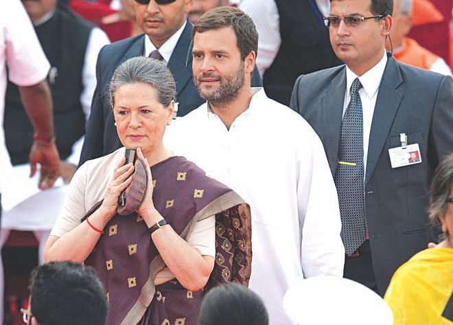 Congress Party President Sonia Gandhi (L) and her son and party Vice President Rahul Gandhi arrive at the swearing-in ceremony for new Indian Prime Minister Narendra Modi at the Presidential Palace.  Photo: AFP