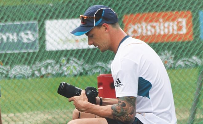 South Africa paceman Dale Steyn is checking his lens during break of his training session at the Zohur Ahmed Chowdhury Stadium on Sunday.  Photo: Star File
