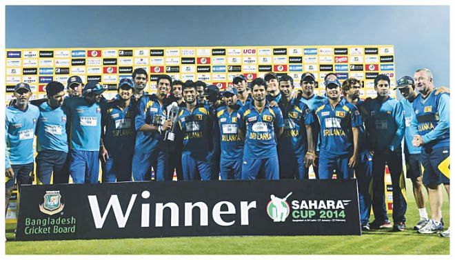  Sri Lanka team pose with the Sahara Cup T20I trophy after winning the series 2-0 yesterday. Photo: Anurup Kanti Das