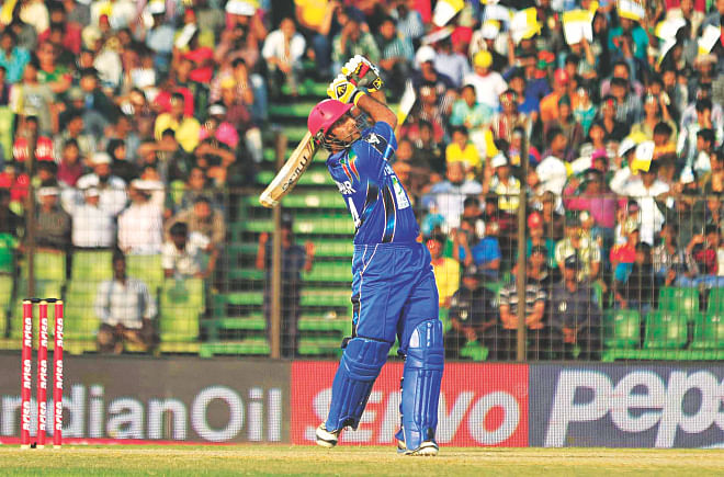 STAND AND DELIVER: Afghanistan's Asghar Stanikzai follows the path of the ball after dispatching it for a six on way to hammering an unbeaten 90 in his side's Asia Cup match against Bangladesh at Fatullah yesterday. PHOTO: FIROZ AHMED