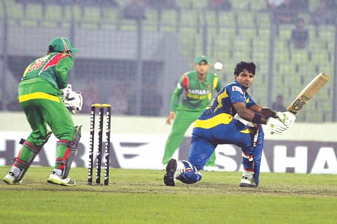 Sri Lanka opener Kusal Perera sweeps one fine on way to scoring his maiden century in the third and final one-day international against Bangladesh at the Sher-e-Bangla National Stadium in Mirpur yesterday. The hosts lost the match by six wickets after they posted 240 for 8. PHOTO: STAR