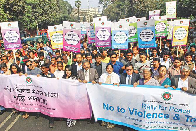 National Human Rights Commission brings out a procession from before Bangladesh National Museum demanding that peace be restored in the country. Photo: Star
