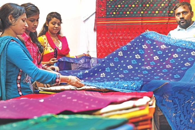 Jamdani saris are on display at a stall at a seven-day fair organised by Bangladesh Small and Cottage Industries Corporation at Bangladesh National Museum in Dhaka yesterday. Photo: Star 