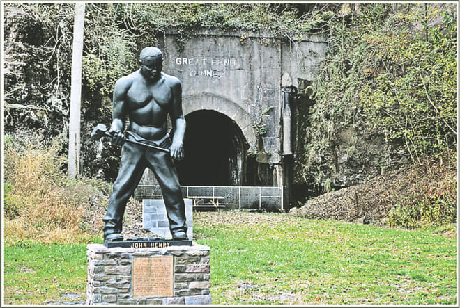 John Henry statue, with the legendary tunnel in the background, in Talcott, West Virginia. 
