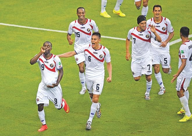 Costa Rica's wonder boy Joel Campbell (L) led his team to a magnificent come-from-behind 3-1 win against former World champions Uruguay at the Castelao Stadium in Fortaleza yesterday. The 21-year-old scored one and assisted the third to stun a Luis Suarez-less Uruguay. Photo: AFP