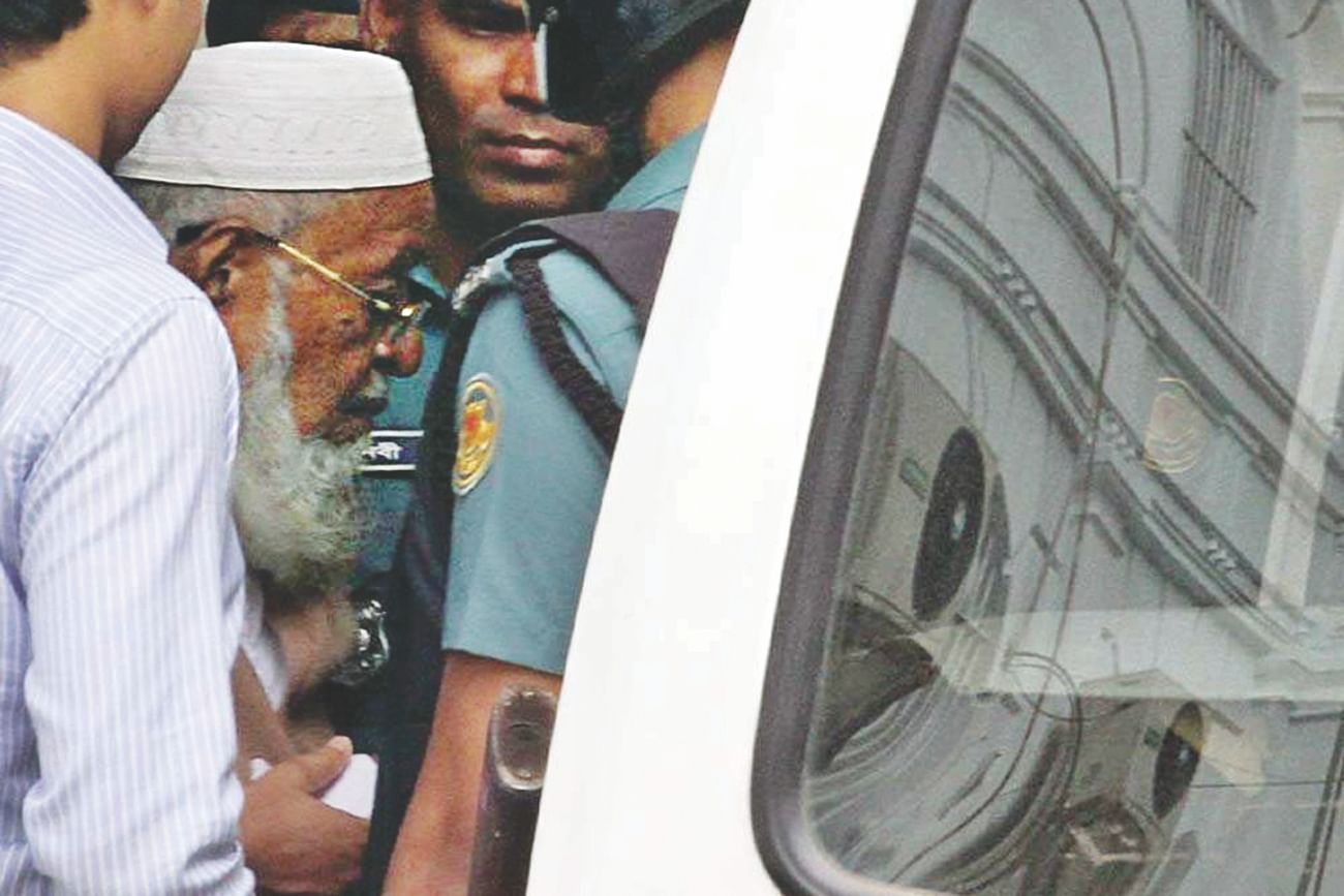 Subhan being taken back to jail from the International Crimes Tribunal yesterday after the court sentenced him to death for committing crimes against humanity. Photo: Star