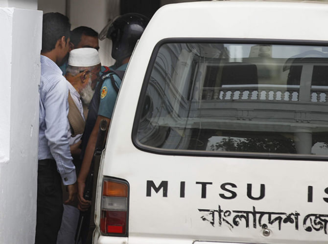 Law enforcers take Jamaat-e-Islami leader Abdus Subhan inside a vehicle from the International Crimes Tribunal in Dhaka after the court pronounces death penalty as punishment for his war crimes in 1971. Photo: Star