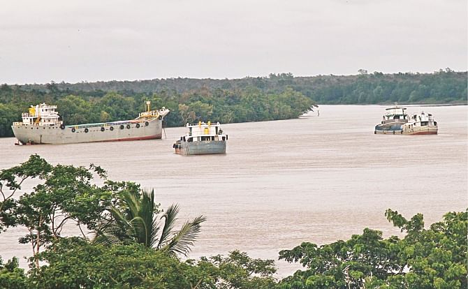 Cargo vessels and oil tankers sail across the Shela river crisscrossing the Sundarbans, posing a risk of ecological disaster to the world's largest mangrove forest through spill of oil and other harmful substances and sound pollution that can scare away wild animals.  Photo: Anisur Rahman 