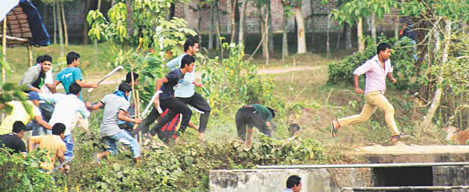 A group of Chhatra League activists with sharp weapons chases their rivals, out of frame, during an infighting at Shahjalal University of Science and Technology in Sylhet yesterday.  Photo: Banglar Chokh 