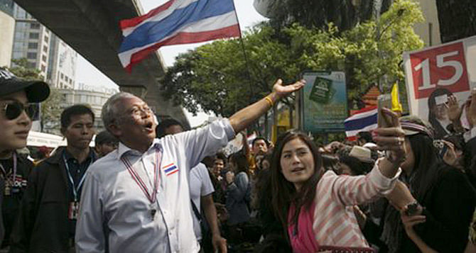 Suthep Thaugsuban (left) and his backers have been protesting since November. Photo: BBC
