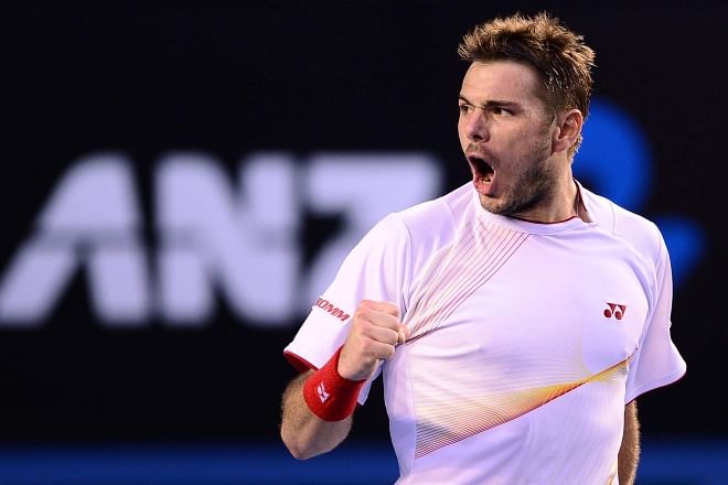 Switzerland's Stanislas Wawrinka punches the air in joy after overcoming defending chamipon Novak Djokovic of Serbia in a gruelling four-hour Australian Open quarterfinal in Melbourne yesterday. Photo: Internet