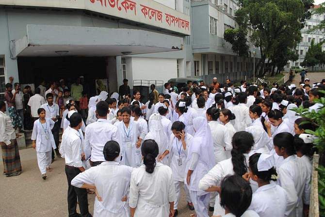 Students of Sylhet Nursing College demonstrate in front of Sylhet MAG Osmani Medical College Hospital Monday, protesting an attack on some of them, allegedly by interns of the hospital. Photo: Star