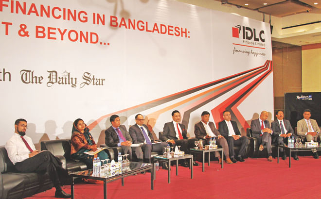 Officials of banks and other financial institutions take part in a seminar on syndicated financing, organised by IDLC Finance in partnership with The Daily Star at Radisson Hotel in Dhaka on Wednesday.  Photo: IDLC