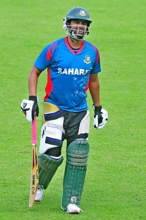 Opening batsman Tamim Iqbal is in obvious pain as he leaves the practice field after being hit by a Taskin Ahmed yorker in Mirpur yesterday. PHOTO: FIROZ AHMED