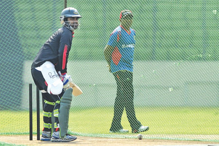 Tamim Iqbal, who attended an individual training session, bats in the nets while Chandika Hathurusingha looks on. PHOTOS: STAR