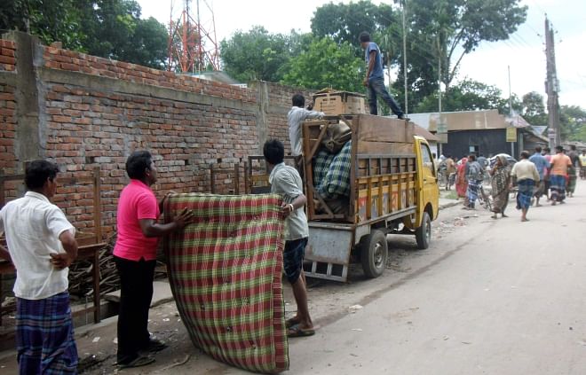 Belongings of a resident of Kandapara brothel in Tangail town being taken on a truck Sunday morning as local influential people forced around 1,500 sex workers to leave the 200-year-old red light area the night before.   PHOTO: STAR