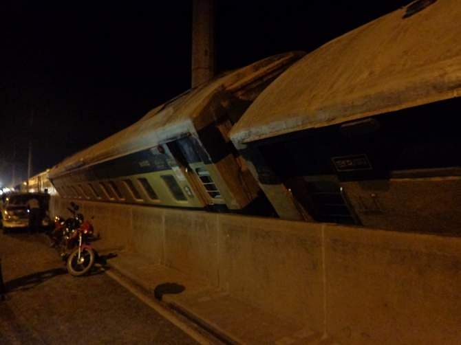 Nine compartments of Dinajpur-bound Drutojan Express derailed and tilted on Bangabandhu bridge after a wind swept through the area Sunday night. Photo: STAR 