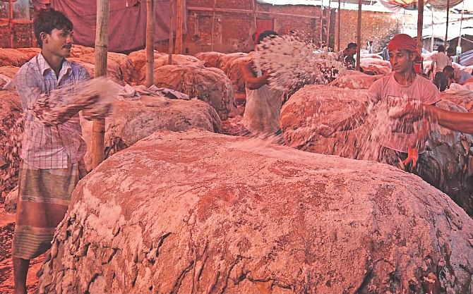 Tanners are busy preserving leather collected from different areas after the Eid-ul-Azha at Muradpur in Chittagong.  Photo: anurup kanti das