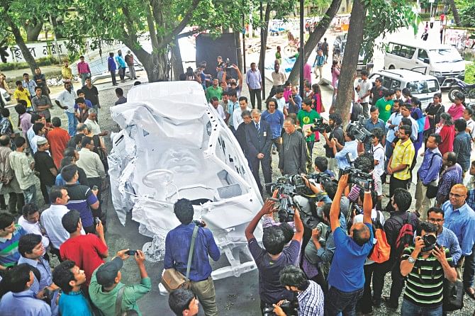 A memorial installation made out of the wreckage of the microbus filmmaker Tareque Masud and media personality Mishuk Munier had been riding, just before a tragic collision took their lives in Manikganj three years ago. The artwork dedicated in the memory of all road accident victims of the country was inaugurated on the Dhaka University campus yesterday.  Photo: Star