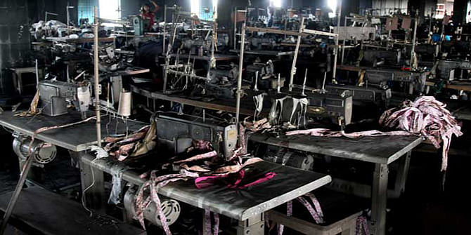 This November 29, 2012 file photo shows the charred machines after a devastating fire that killed 112 workers at Tazreen Fashions in Ashulia, on the outskirts of the capital, Dhaka.
