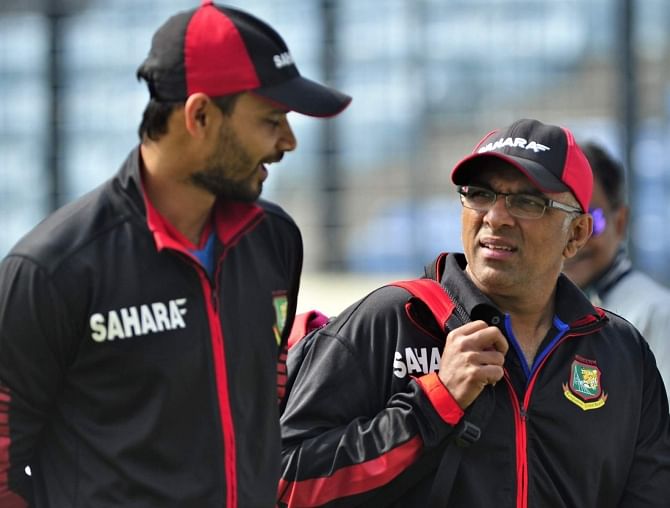 Bangladesh captain Mashrafe Bin Mortaza (L) shares some light moments with coach Chandika Hathurusingha before going to a press conference at the Sher-e-Bangla National Stadium in Mirpur yesterday. Photo: Star
