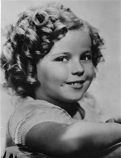 In this Nov 1936 file photo, 8-year-old US American child movie star Shirley Temple is portrayed in Hollywood, Ca., USA. Shirley Temple, the curly-haired child star who put smiles on the faces of Depression-era moviegoers, has died. She was 85. Photo: AP 