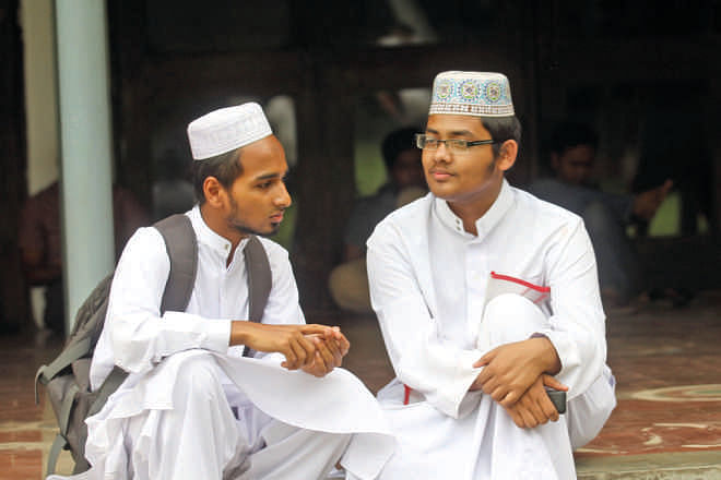 Abdur Rahman (R) topped the B and D Units of the DU  admission test, and Faruk Hossain stood 2nd at the D Unit.  Both studied at Tamirul Millat Kamil Madrasa.   Photo: Prabir Das