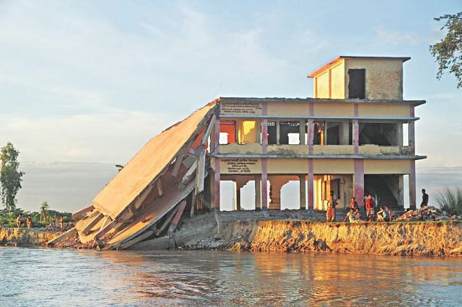 The Teesta devours a school at Dhusmara Char in Kaunia of Rangpur jeopardising the dreams of several hundred students. The partially collapsed school had to be demolished. The photo was taken in July. Photo: Mehdi Hasan