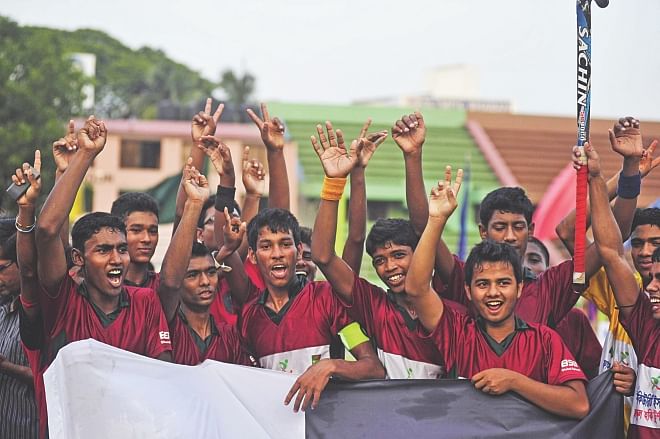 The victorious Al Hikma School of Rajshahi celebrate their win over Jessore Municipal Preparatory School in the final of the First Security Islami Bank National School Hockey Championship at the Maulana Bhasani Hockey Stadium yesterday. PHOTO: STAR