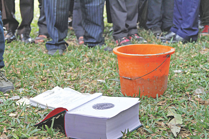 A book inside which one of the three bombs was hidden at a courtroom of the High Court yesterday. Photo: Sk Enamul Haq