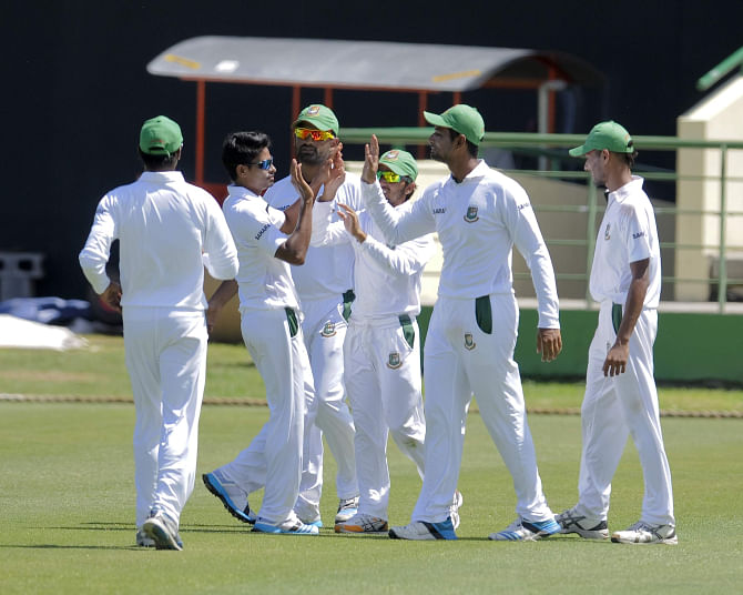 Bangladeshi players celebrate slow left-armer Taijul Islam's first wicket of the West Indies tour during the second day of their three-day practice match against St Kitts and Nevis at St Kitts on Sunday. Taijul is expected to make his debut in the Test series for the Tigers.  Photo: WICB 