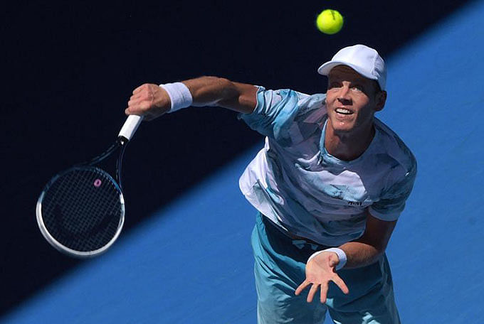 Tomas Berdych serves during his Australian Open match against Viktor Troickion in Melbourne on January 23, 2015. Photo: AFP