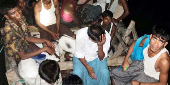 This photo taken on June 16, 2012 shows fortune seekers who were rescued after a trawler, on which they were travelling to Malaysia, capsized in the Bay of Bengal.