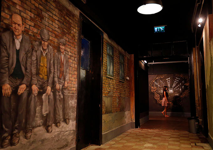 A player walks in the corridor at escape room games TrapFactory in Budapest August 4, 2014. Photo: Reuters 