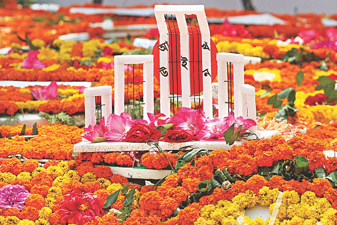 A miniature Shaheed Minar decorated with flowers at the Central Shaheed Minar on Amar Ekushey yesterday. Photo: Anisur Rahman