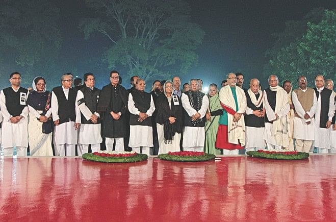 Awami League President Sheikh Hasina and the party leaders pay their respects at the Central Shaheed Minar in the capital in the early hours yesterday marking International Mother Language Day. Photo: Sk Enamul Haq, Anisur Rahman, Palash Khan
