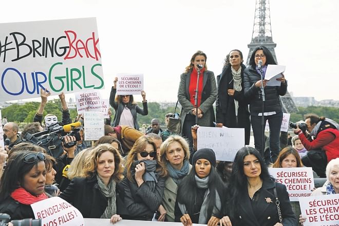 (From 3rd L) Former UMP mayoral candidate in Paris Nathalie Kosciusko-Morizet, former French first lady Carla Bruni, MP Valerie Pecresse, and (From 8th L) French actress Charlotte Valandrey, French singer Line Renaud take part with others in a demonstration for the release of the Nigerian schoolgirls held hostage by the Islamists in Nigeria on the Trocadero plaza in Paris, yesterday.  Photo: AFP