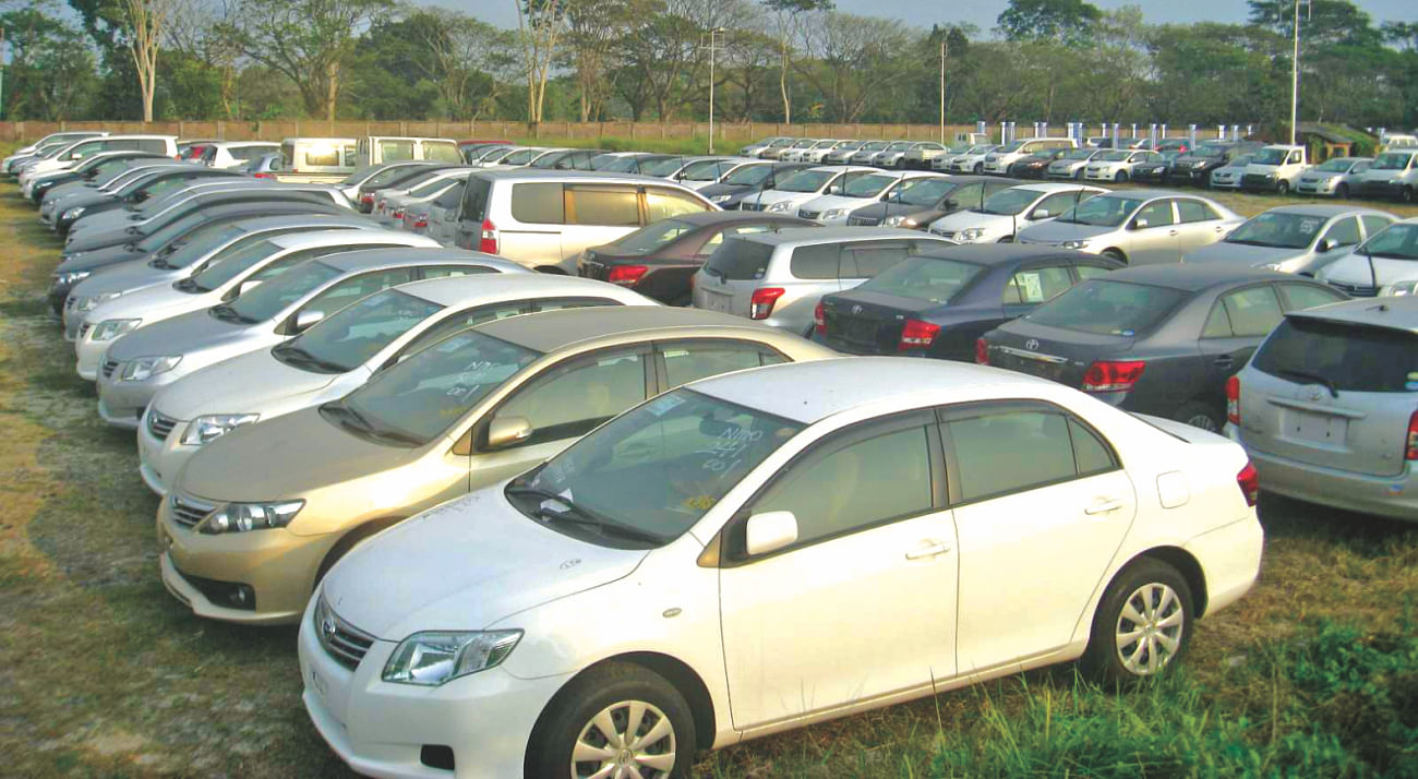 Imported cars are stranded at Mongla port as importers are reluctant to take delivery of the vehicles amid fears of vandalism during the blockade on the highways.  Photo: Sohel Parvez