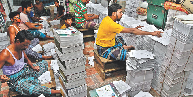 Textbooks for school children being prepared at Bangla Bazar of Old Dhaka for shipment. The government is on schedule to get the books to the children on time this year.  Photo: Amran Hossain