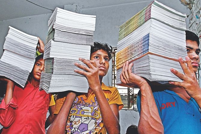 Textbooks of school children being taken for shipment to upazilas from a printer in Bangla Bazar in Old Dhaka. Photo: Amran Hossain