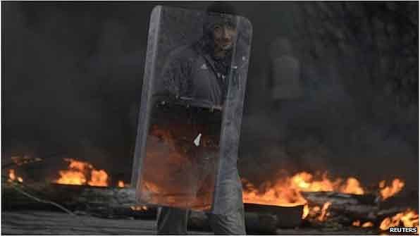 Protesters burned tyres and bolstered their defences before the government operation began