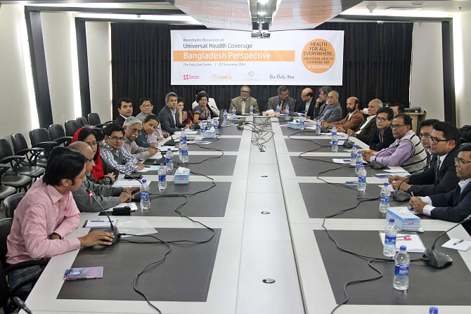 Participants of a discussion titled 'Universal Health Coverage: Bangladesh Perspective' organised by Brac, International Centre for Diarrhoeal Disease Research, Bangladesh (icddr, b), the Centre of Excellence for Universal Health Coverage and The Daily Star at the newspaper's office in the capital yesterday. Photo: Star
