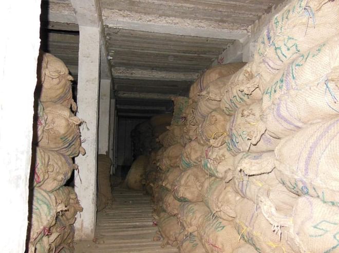 Huge quantity of potatoes lie stacked at Kishan Cold Storage in Rangpur city as the traders did not withdraw them by the stipulated time last December due to drastic price fall of the popular winter vegetable because of  blockades and hartals during the last couple of months. PHOTO: STAR