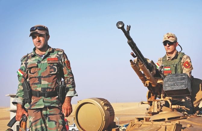Kurdish Peshmerga fighters take position to fight against Islamic State militants.  US jets struck jihadist positions in northern Iraq on Friday and yesterday, making it a potential turning point in the two-month crisis Washington said was threatening to result in genocide. Photo: Afp, Ap