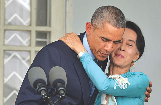 US President Barack Obama embraces Myanmar's opposition leader Aung San Suu Kyi during a press conference at her home in Yangon yesterday.  Photo: AFP